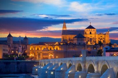 Cordoba & & The Mosque Small-Group Day Tour from Seville - La Judería: Colored Streets, Flowered Courtyards, and a City You Can Read