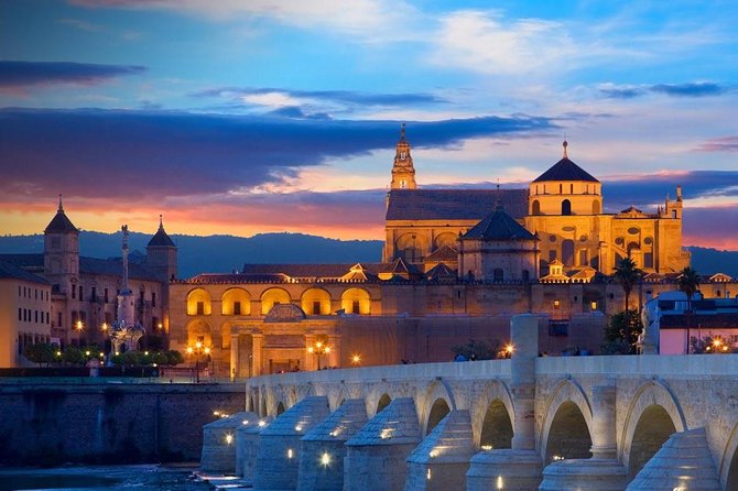 Cordoba & & The Mosque Small-Group Day Tour from Seville - La Judería: Colored Streets, Flowered Courtyards, and a City You Can Read