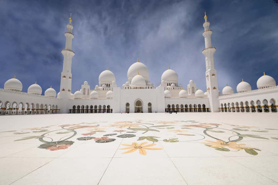 From Dubai: Abu Dhabi Grand Mosque Visit & Theme Park Option - Your afternoon choice: Ferrari World, Louvre Abu Dhabi, or Warner Bros.