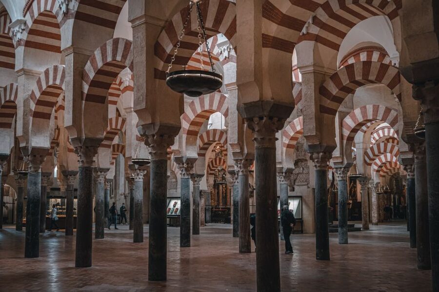 From Seville: Cordoba and Mosque Cathedral Guided Tour - The Mosque-Cathedral (Mezquita): 856 columns and the story inside