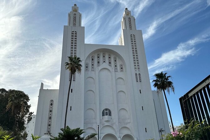 Private City Tour Casablanca includes Hassan II Mosque - Church of Notre Dame of Lourdes: stained glass, a cave, and calm contrast